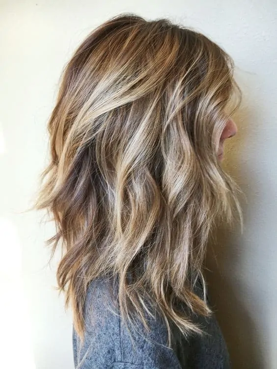 Long Messy Curls with Blonde Balayage