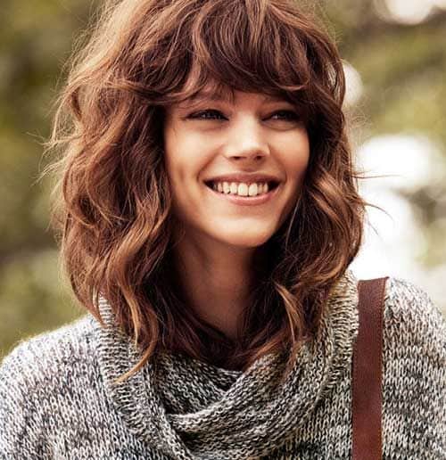 Medium Length Hairstyles for Thick Wavy Hair with Bangs