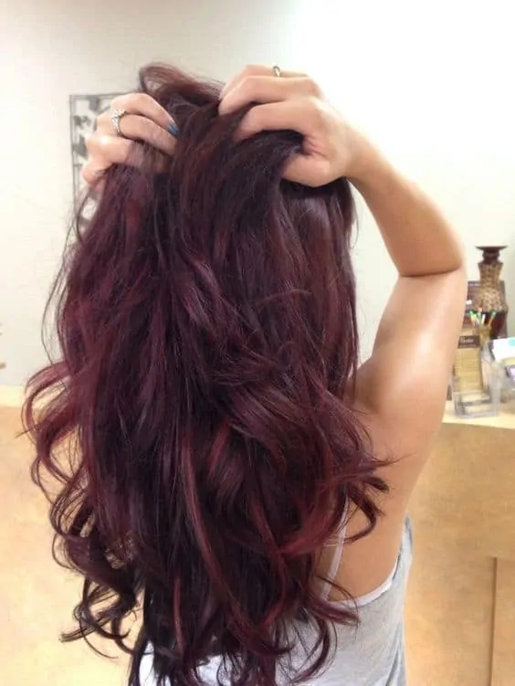 Red violet hair color with red burgundy highlights