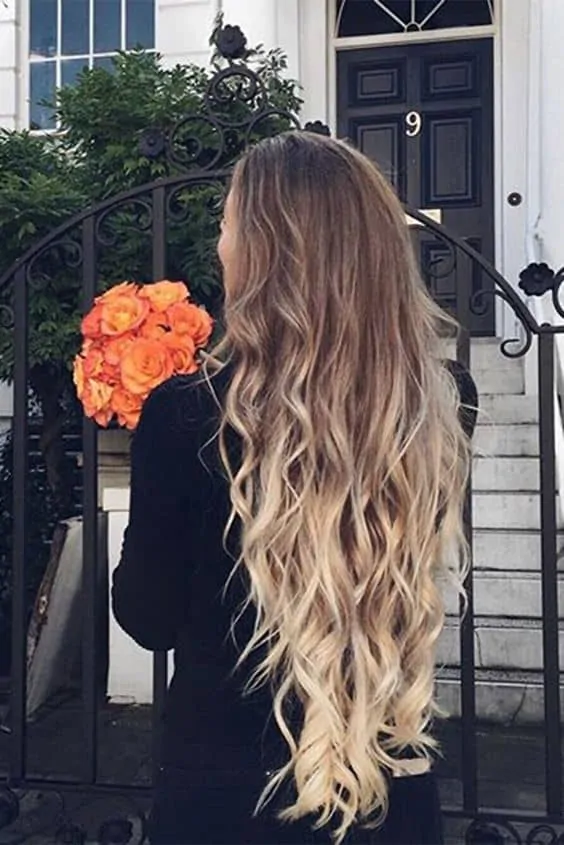 Long layered voluminous ombre blonde curls